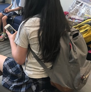 student-looking-at-phone.jpg