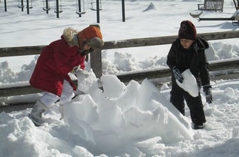 Whitby Students building a snow structure on a Snow Day