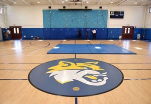 The Whitby school gym, featuring a rock climbing wall and 3 basketball courts