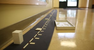 View of a Montessori long chain on the ground in a hallway