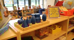 Blue shapes sitting on a classroom bookshelf